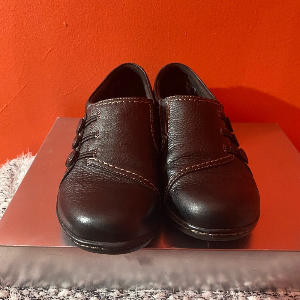 A Pair of Black Clarks Ashland Effie Slip-on Loafer Shoe.